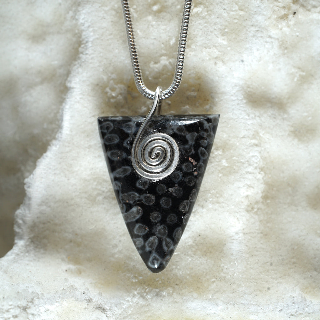 FC05P Fossilised Coral Triangle pendant with sterling silver Celtic spiral from Angela Kelly Jewellery Enniskillen Fermanagh