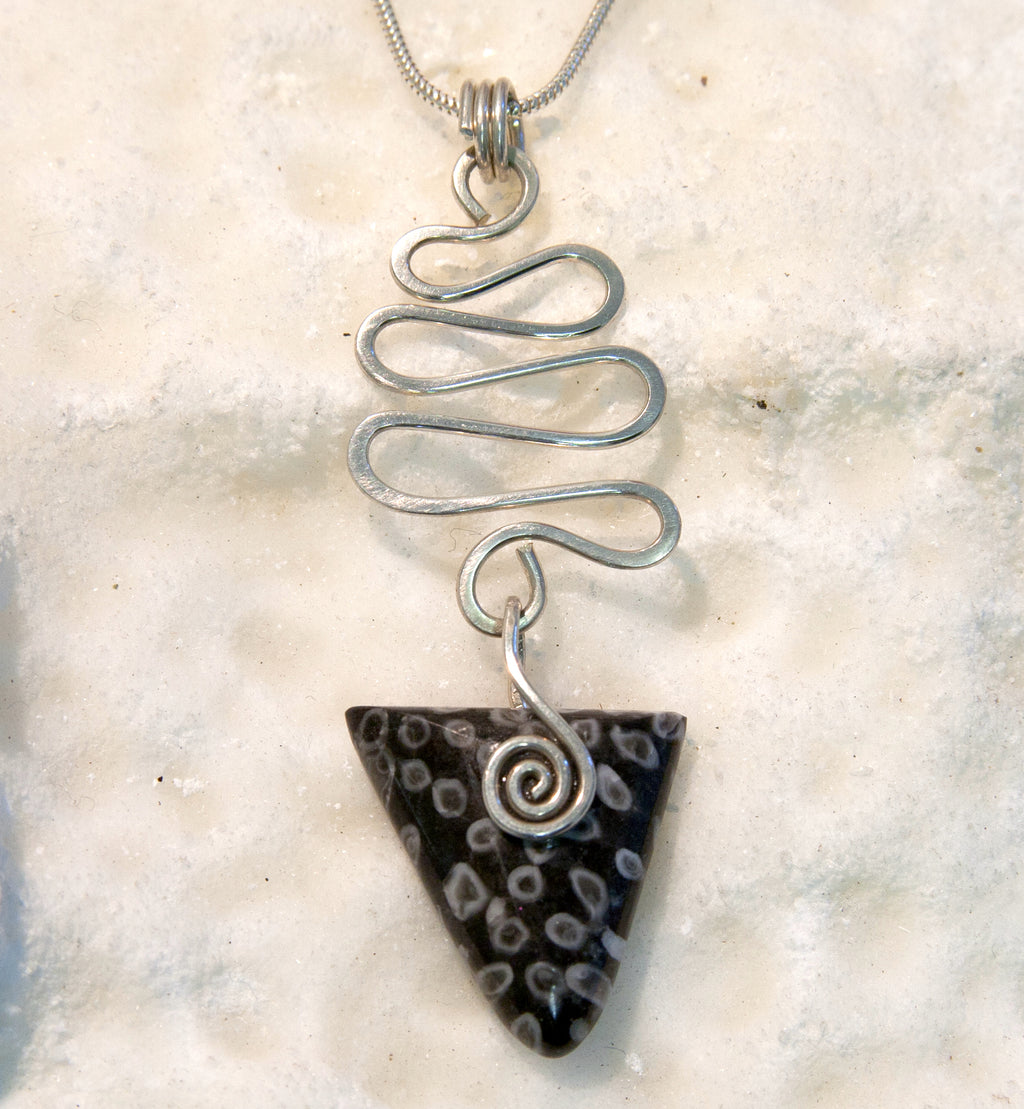 RJ09P Fossilised Coral Celtic triangle pendant with wavy silver wire detail from Angela Kelly Jewellery Enniskillen Fermanagh