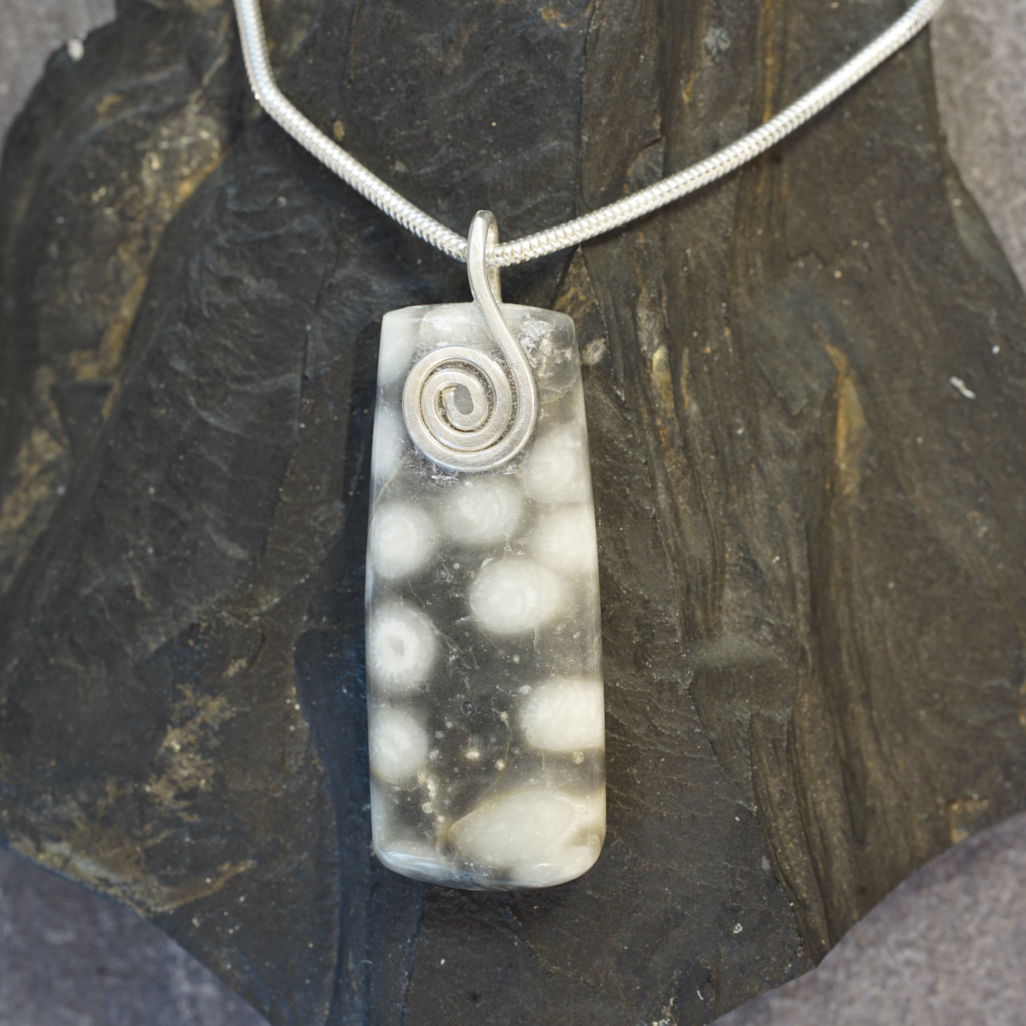 FMC12P Fermanagh Marbled Coral rectangle pendant with a sterling silver Celtic spiral from Angela Kelly Jewellery Enniskillen Fermanagh